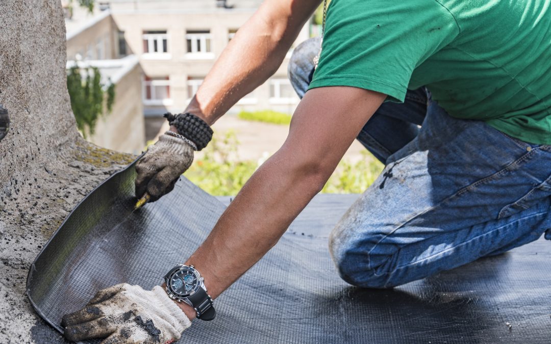 Worker performs overhaul of the roof of a residential building